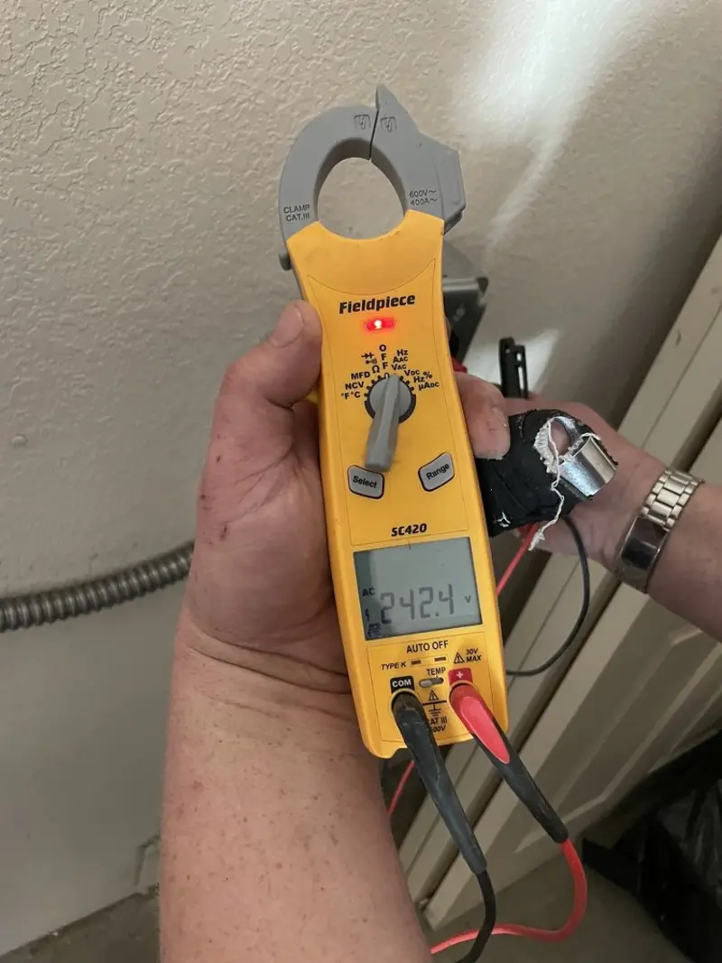 Voltage testing with clamp meter during Recessed Lighting Installation in Ontario